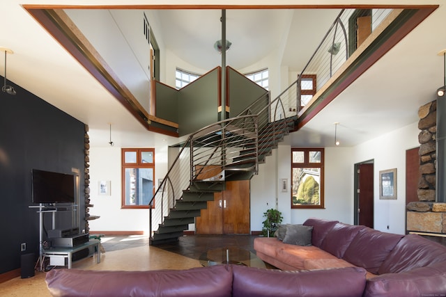 living room featuring a high ceiling