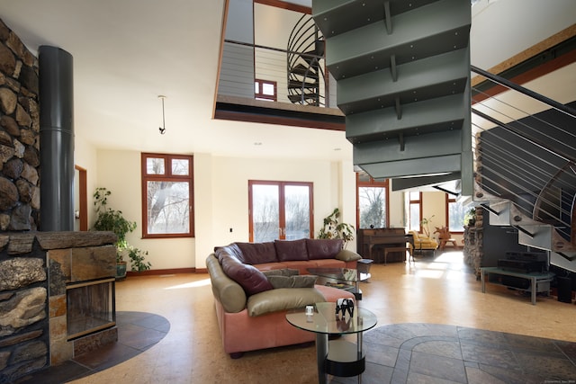 living room featuring a towering ceiling