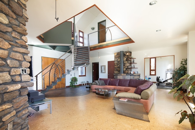 living room featuring plenty of natural light and a high ceiling