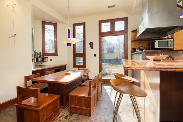 dining space featuring plenty of natural light