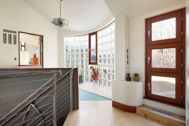 foyer featuring lofted ceiling