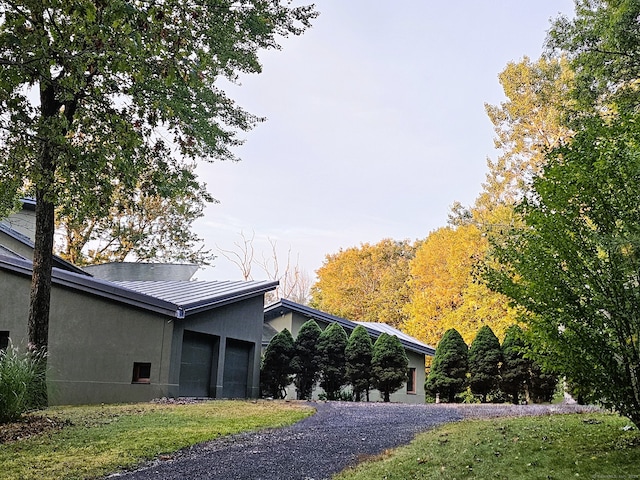 view of side of home featuring a garage