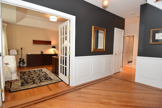 corridor with light hardwood / wood-style floors