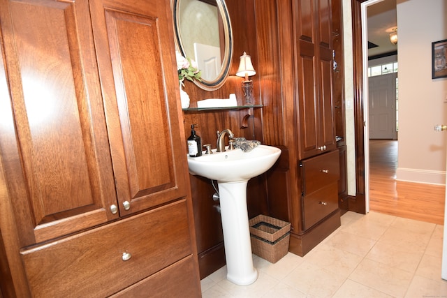 bathroom with hardwood / wood-style flooring