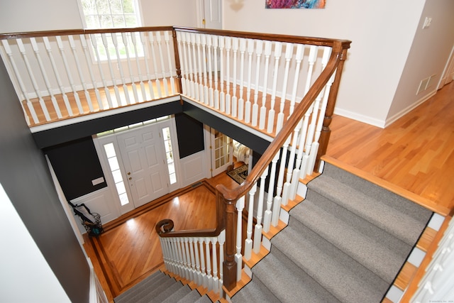 staircase featuring hardwood / wood-style floors