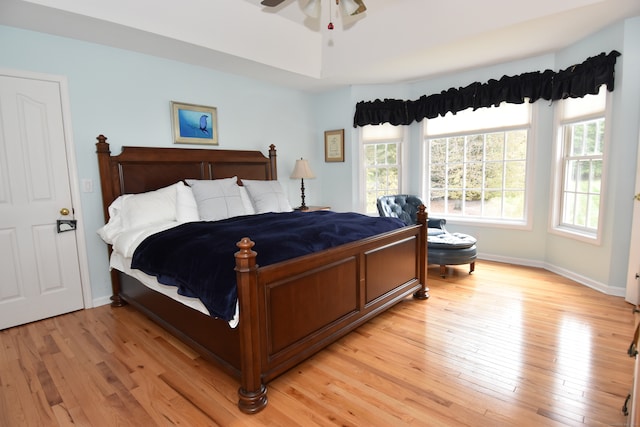 bedroom featuring light hardwood / wood-style floors and ceiling fan