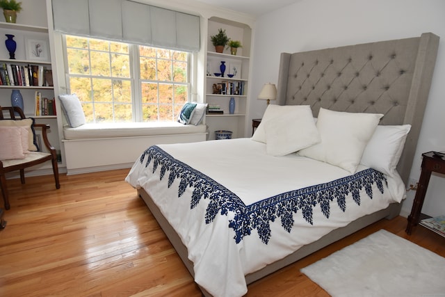 bedroom with light hardwood / wood-style floors