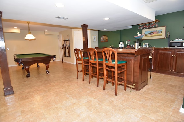 bar featuring pool table, ornate columns, and pendant lighting