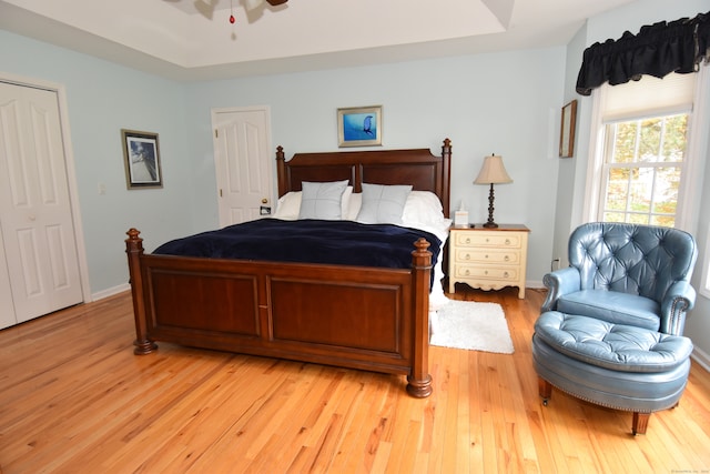 bedroom featuring light hardwood / wood-style flooring and ceiling fan