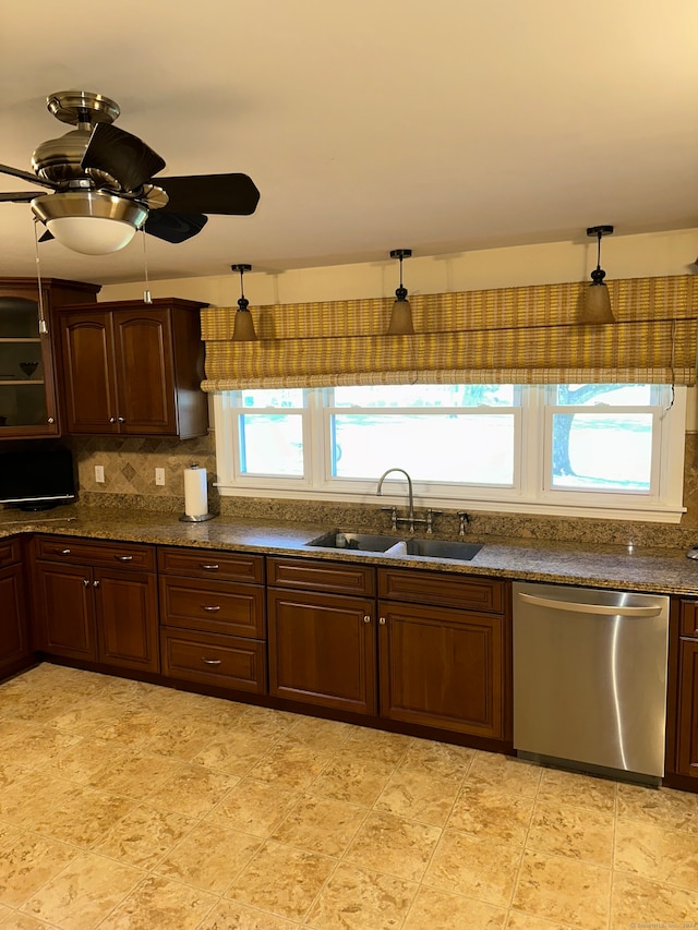 kitchen with sink, dishwasher, decorative backsplash, and a healthy amount of sunlight