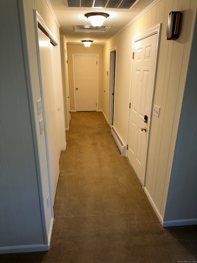 hall with ornamental molding, carpet flooring, and a baseboard radiator