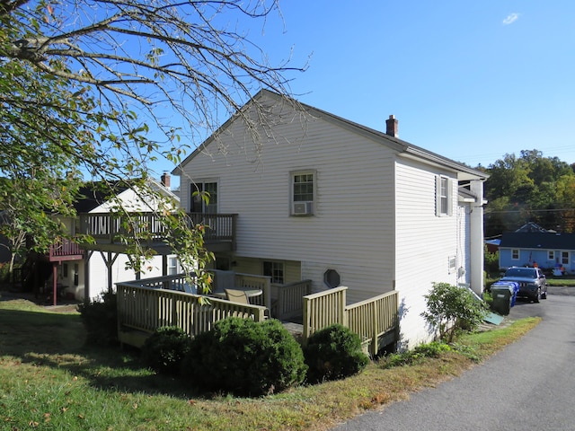 view of home's exterior with a deck