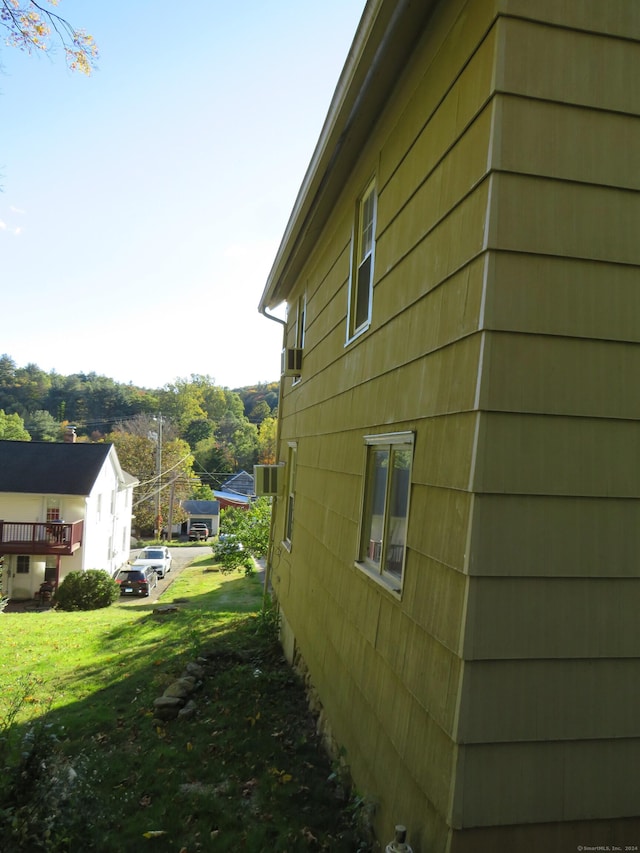 view of home's exterior featuring a lawn