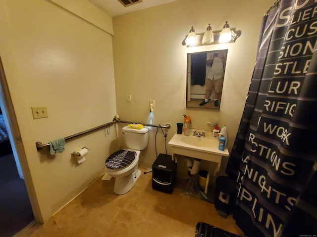 bathroom with sink and toilet