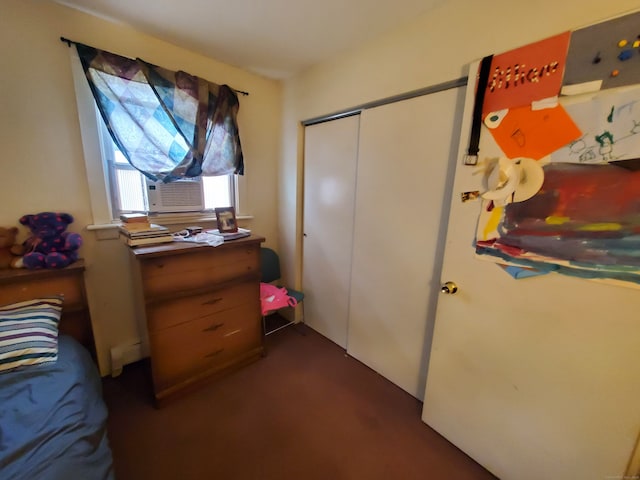 bedroom with a closet and cooling unit