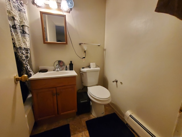 bathroom featuring vanity, toilet, and a baseboard heating unit