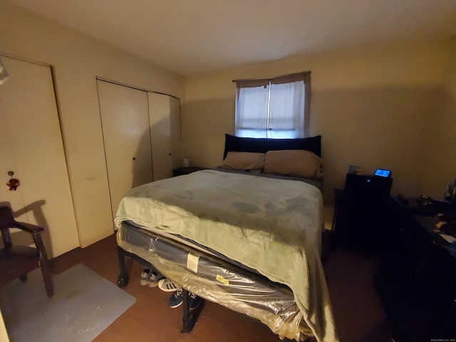 bedroom featuring dark colored carpet