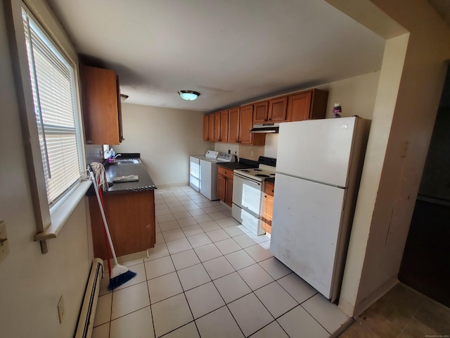 67 Enfield St Unit 37, Hartford, CT 06112 - kitchen with white appliances, under cabinet range hood, a baseboard heating unit, brown cabinets, and dark countertops