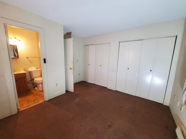 67 Enfield St Unit 37, Hartford, CT 06112 - unfurnished bedroom with carpet flooring, multiple closets, ensuite bathroom, and a baseboard heating unit