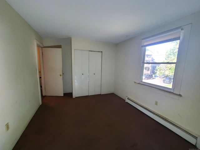67 Enfield St Unit 37, Hartford, CT 06112 - unfurnished bedroom with baseboard heating, a closet, and carpet flooring