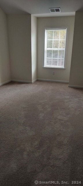 unfurnished room featuring carpet floors