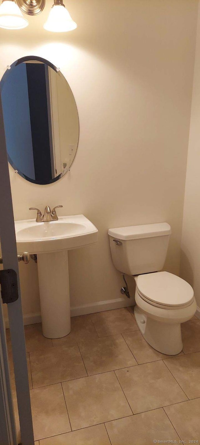 bathroom featuring tile patterned floors and toilet