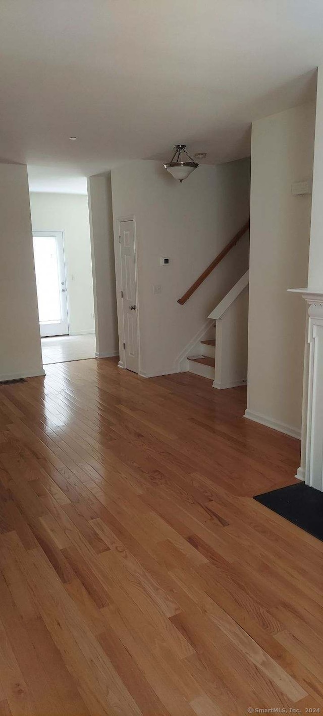 unfurnished living room featuring light hardwood / wood-style flooring