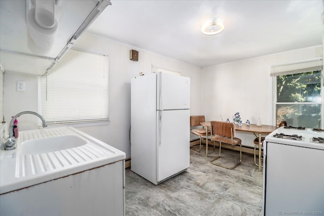 kitchen with white appliances and white cabinetry