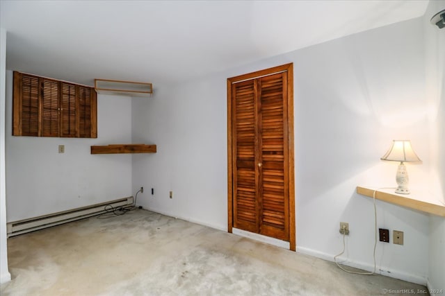 empty room with light carpet and a baseboard radiator