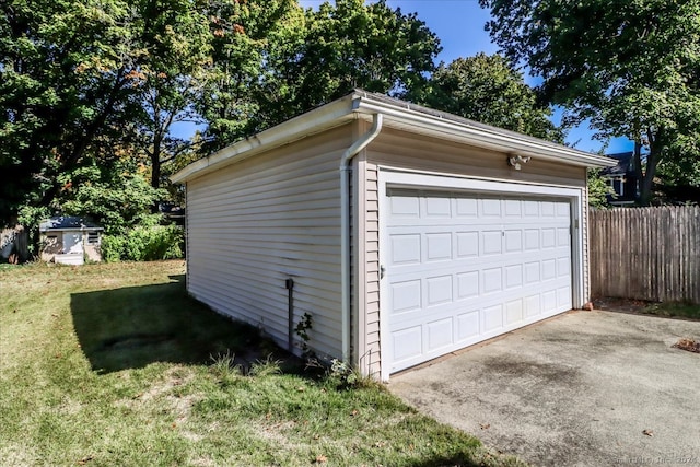 garage featuring a lawn