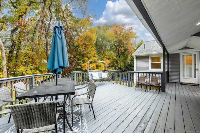 wooden deck with outdoor dining area