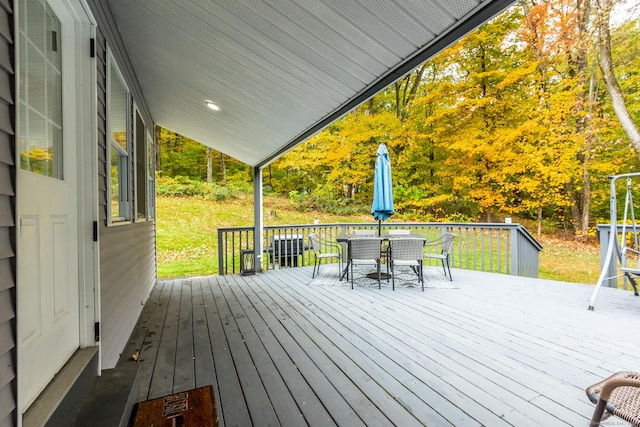 deck featuring outdoor dining area