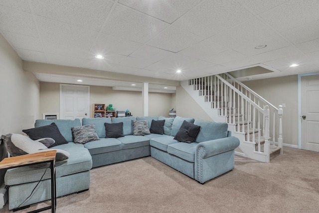 carpeted living room featuring recessed lighting, stairway, and baseboards