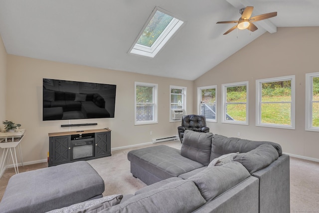 carpeted living room with vaulted ceiling with skylight, baseboards, baseboard heating, and ceiling fan