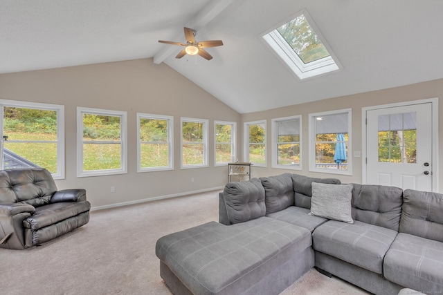 sunroom with lofted ceiling with skylight and a ceiling fan