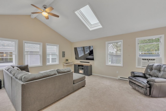 living area featuring a ceiling fan, baseboards, a baseboard radiator, light carpet, and lofted ceiling with skylight