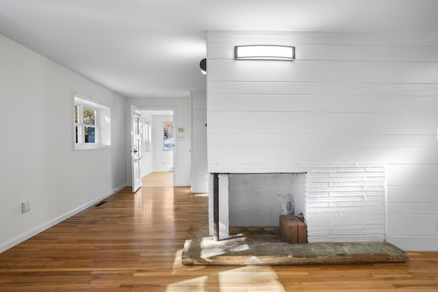 unfurnished living room featuring dark hardwood / wood-style floors