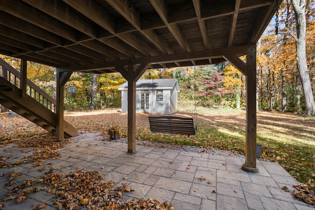 view of patio with a shed