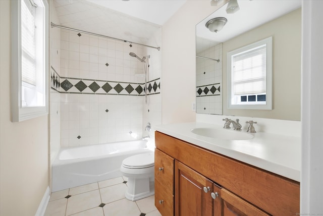 full bathroom with tiled shower / bath, vanity, toilet, and tile patterned flooring