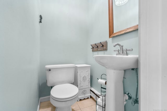 bathroom with tile patterned floors and toilet