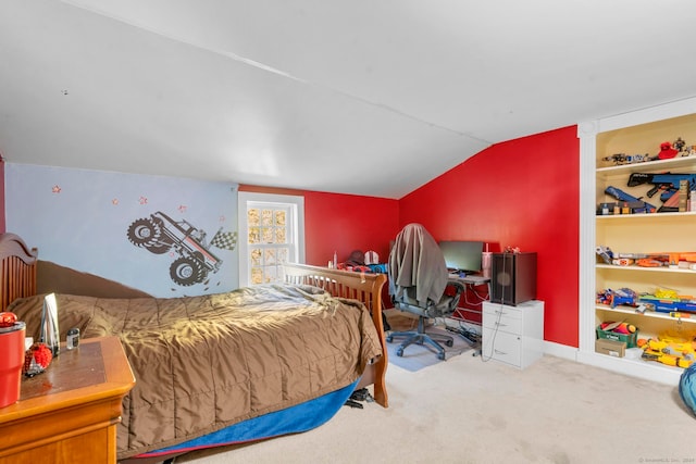 bedroom with vaulted ceiling and carpet floors