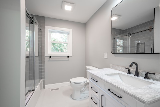 bathroom featuring toilet, walk in shower, and vanity