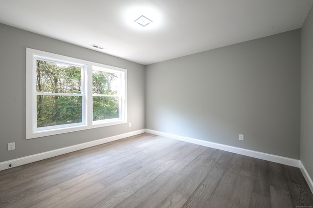 empty room featuring hardwood / wood-style floors