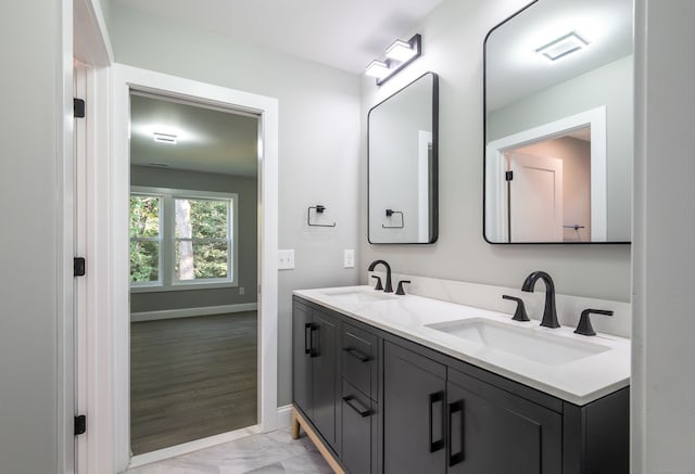 bathroom with vanity and hardwood / wood-style floors