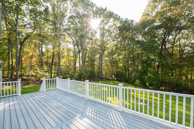 wooden terrace with a yard