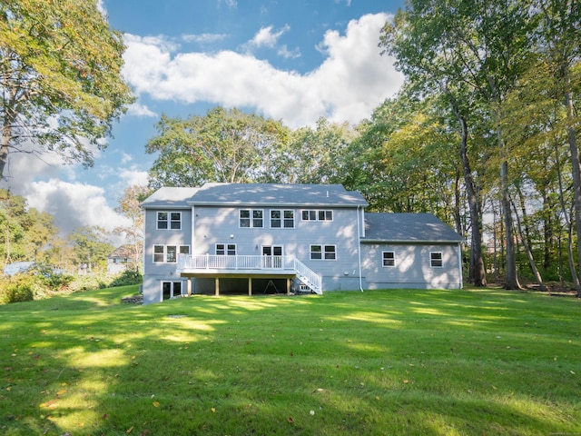 back of property featuring a yard