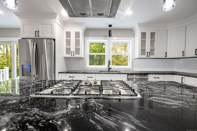 kitchen featuring white cabinetry, appliances with stainless steel finishes, and pendant lighting