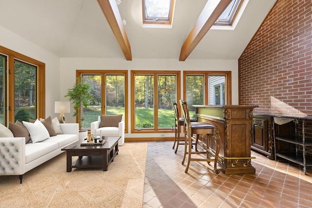 sunroom featuring a wealth of natural light and vaulted ceiling with skylight