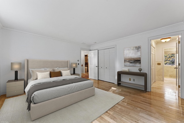 bedroom with light hardwood / wood-style flooring and ornamental molding