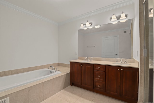 bathroom with vanity, crown molding, tile patterned flooring, and tiled bath